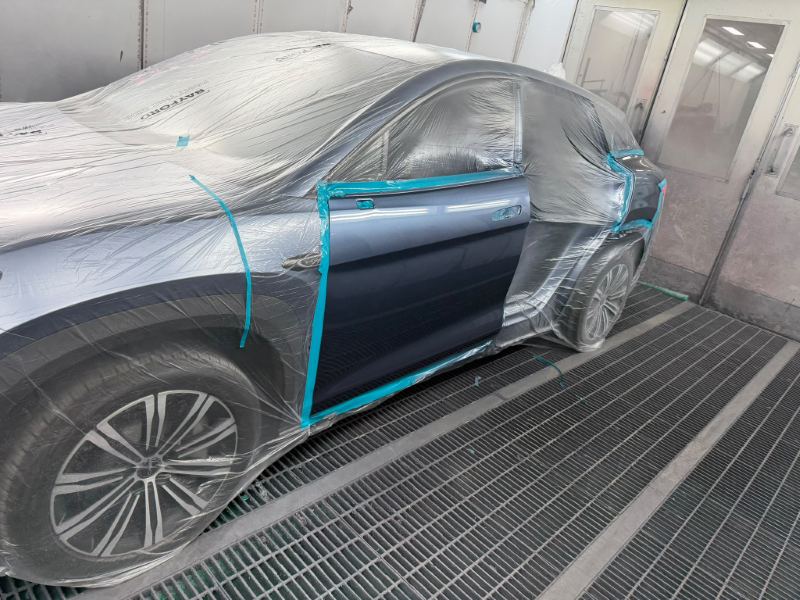 Side view of the masked SUV showing the prepared door opening